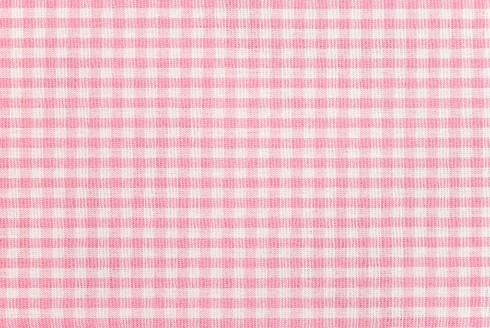 A pink gingham pattern fabric background